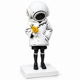 Deep Sea Dreamer sculpture in white & black with yellow bird, on a white studio background