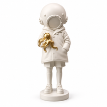 Golden Encounter diver and octopus sculpture in white & gold, on a white studio background