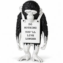 Silent Protest sculpture in black drip, on a white studio background