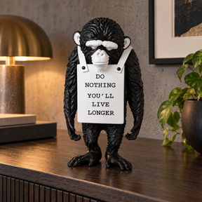 Silent Protest sculpture in classic black & white, displayed in a styled interior