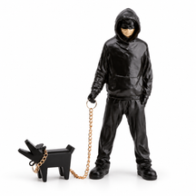 Urban Companion hooded figure and dog sculpture in black & gold, on a white studio background
