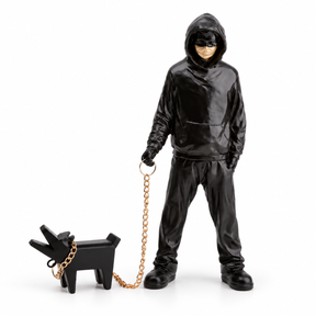 Urban Companion hooded figure and dog sculpture in black & gold, on a white studio background