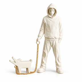 Urban Companion hooded figure and dog sculpture in white & gold, on a white studio background